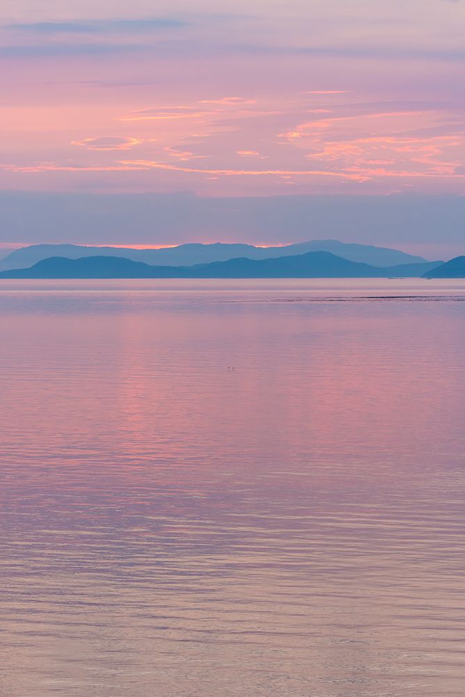 USA, San Juan Islands, Washington Reflected sunset sky from Sucia Island view to Strait of Georgia.